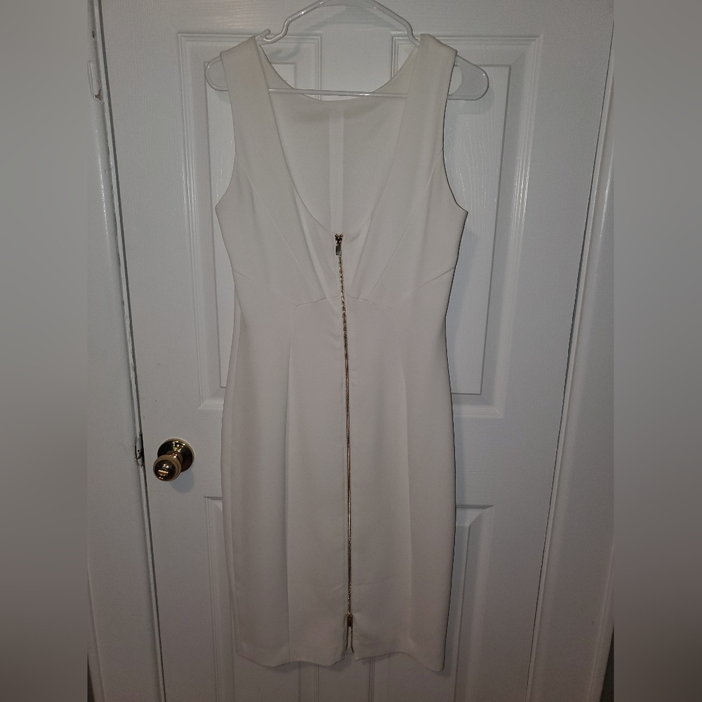 H&M, White form-fitting dress with gold zipper in back. Size 10